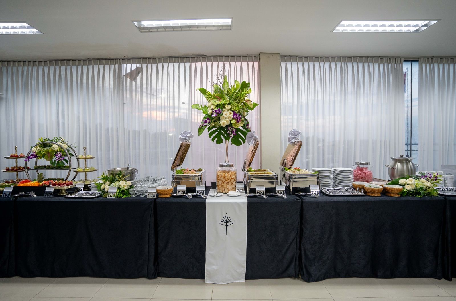 Full catering buffet spread with floral styling