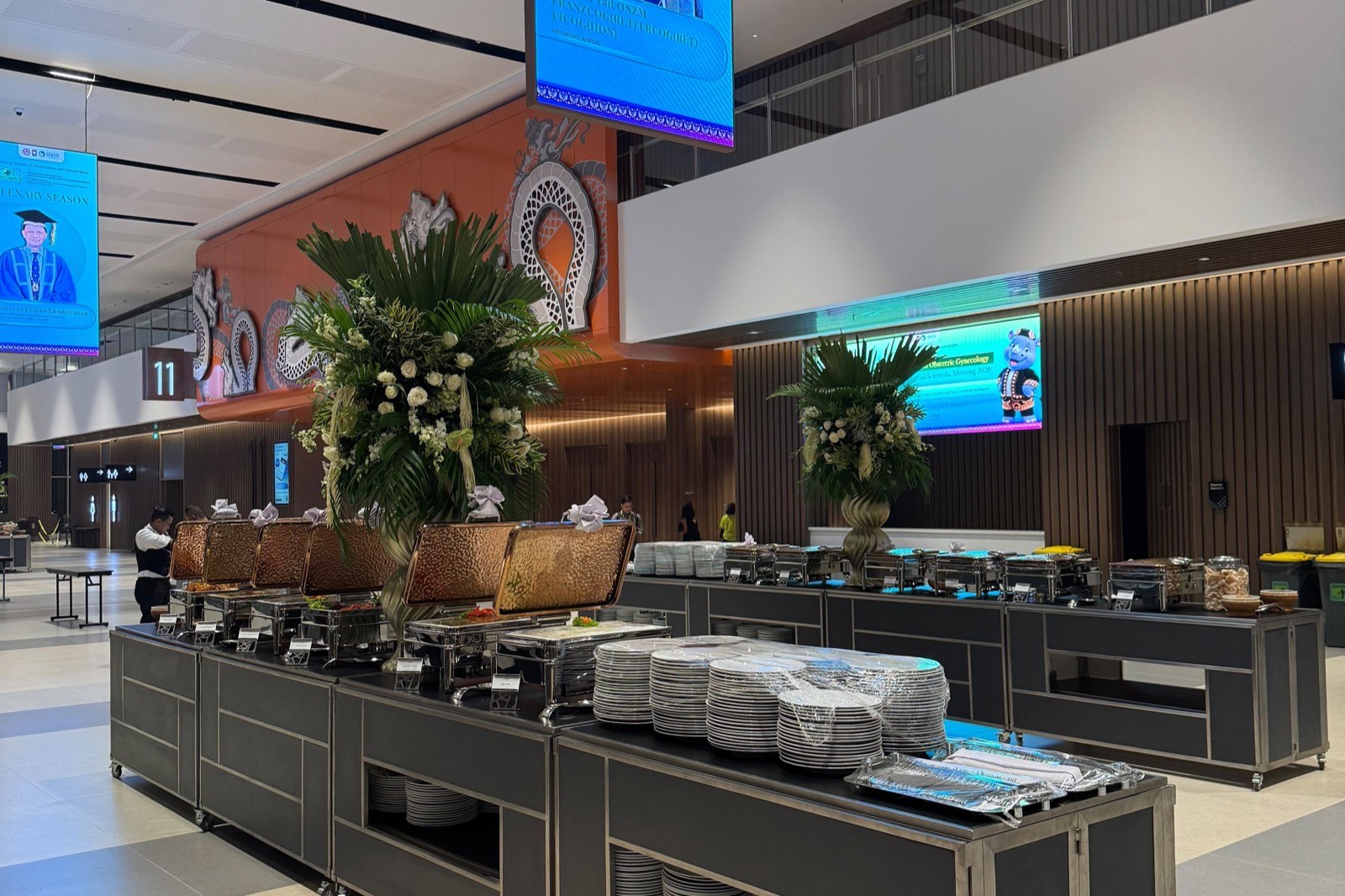 Live catering station serving guests in a corporate atrium